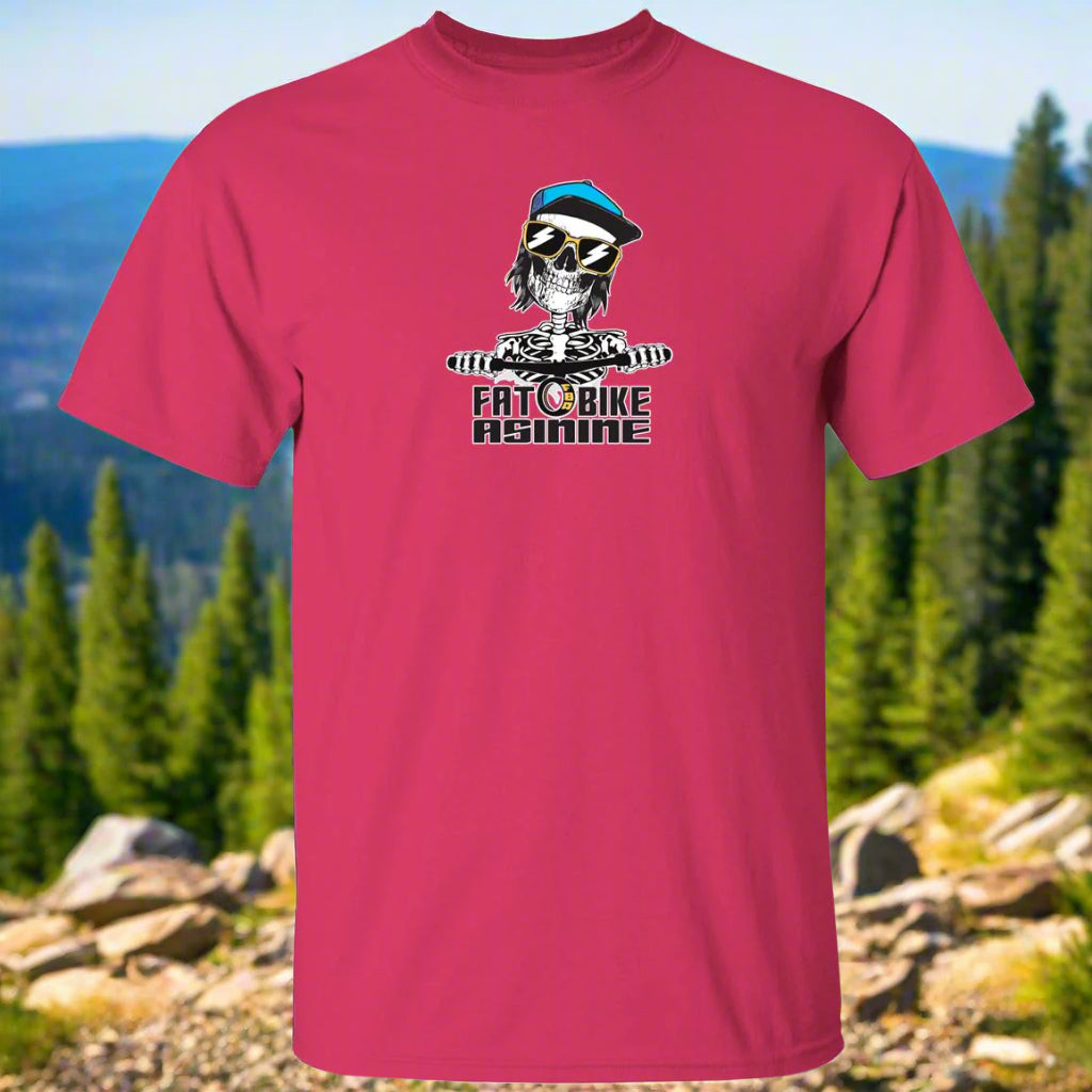 A pink t-shirt with a graphic print of a skull wearing sunglasses and the text 'FAT BIKE ASININE' on the front.