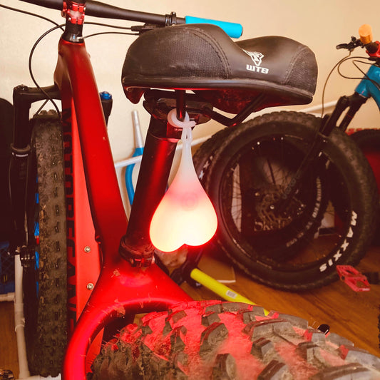 Bike Balls Cycling Red Tailgate Safety Light | Bike Nuts for Fat Bike, Mountain Bike, Road Bike | Fat Bike Asinine Bike Balls, Bike Nuts, Cycling Nuts, Balls for bike seat, bike seat nuts, bike seat balls, nuts for bike seat, novelty bike light, funny bike light, best bike light, best bike light for mountain biking, best fat bike accessories, fat bike accessories, best light for fat biking, night biking, riding bike at night, safety bike light